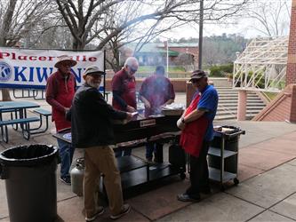 volunteers cooking outside