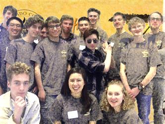 team posing with zoom background