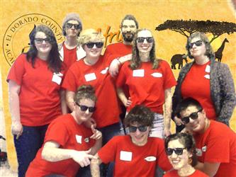 team posing with zoom background