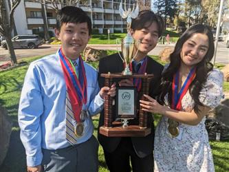 winners with their trophies