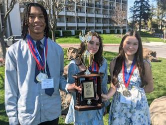 winners with their trophies